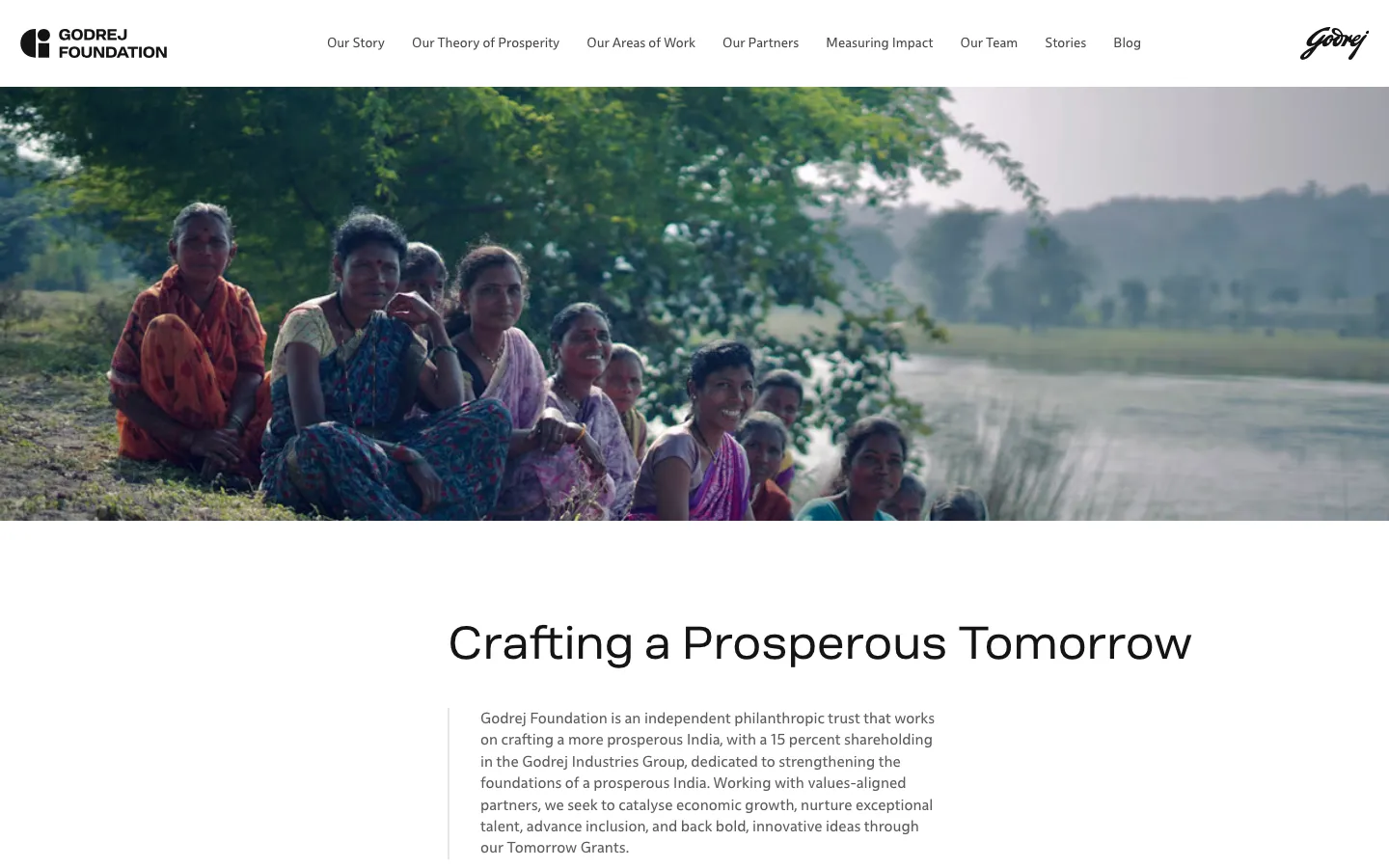Godrej Foundation homepage — Crafting a Prosperous Tomorrow, with hands reaching toward the sky in the hero